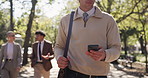 Phone, hands and businessman walk at park for travel, reading email and sustainable project. Trip, outdoor and green consultant with mobile for text, csr and networking online on commute to work
