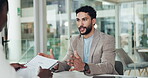 Business, people and interview with document in office for discussion, hiring process and policy. Man, talking and candidate listening with paperwork, review resume and explain recruitment of vacancy