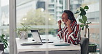 Woman, laptop and headset at office for success, fist pump and celebration with sales at call center. African person, consultant and agent with target, bonus and happy for announcement at company