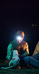 Night, headlamp and man camping with dog, pet owner and outdoor adventure together for bonding. Petting, mockup space and person relax in dark with travel buddy, support and connection with flare.