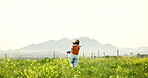 Spinning, couple and hug in field, adventure and love on vacation, traveller and romance for people. Outdoor, man and run to woman in nature, fun and celebration of anniversary on holiday or space