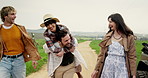 Road trip, piggy back and people in countryside for holiday, vacation and outdoor adventure on weekend. Happy, laughing and couple of friends walking on trail for journey, bonding and travel together