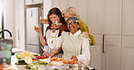 Photograph, toast and senior friends in kitchen of home together for celebration, cooking or visit. Cheers, drink and picture with happy old women in apartment for bonding or culinary lesson