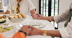 People, holding hands and praying with food in home for gratitude, tradition and respect for lunch. Friends, prayer and blessing for healthy meal, worship God and thankful for cuisine of social event