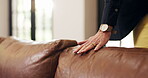 Woman, touch and leather sofa in holiday home for comfort, texture and reflection on good memories. Hand, couch and female person in vacation rental with satisfaction, pride and care for property.