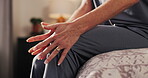 Woman, hands and knee in home with joint pain, muscle injury massage and body care for wellness. Healthcare, female person and rub legs in house for arthritis, inflammation and osteoporosis relief.