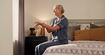 Senior, woman and stretching in bedroom with wrist pain, carpal tunnel or body care for joint injury. Mature, female person or massage in apartment for arthritis, inflammation or osteoporosis relief.