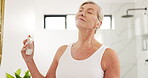 Mature woman, spray and perfume at house for getting ready, fresh smell and grooming routine. Female person, smile and cosmetic fragrance of body hygiene, essence product and liquid aroma in bathroom