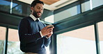 Below, business and man with phone in office for research, social media and review article. Smile, male person and scroll with mobile for browsing website, editor feedback and publication information
