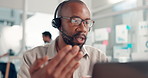 Businessman, consultant and headset with laptop in office for customer service or online advice. Man, employee or agent talking with mic on computer for virtual assistance, chat or help in workplace