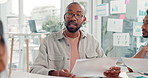 Businessman, meeting and documents with team for project delegation, tasks or agenda in office. Man, employees or group discussion with paperwork for brainstorming, ideas or discussion in workplace