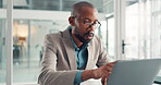 Reading, online and man with laptop, office or research for financial analysis on website and report. Accountant, glasses and black person with project, review and info for business records and tech
