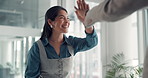 Business woman, smile and high five for celebration, investment profit and talking in office. Team, happy consultant and hands together for success, financial target or excited for goal achievement