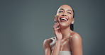 Happy woman, laughing and beauty skincare with space in studio for humor on a gray background. Female person, model or shine with smile or funny moment for glow up, makeup or skin texture on mockup
