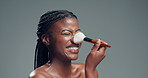 Happy, brush and black woman in studio, makeup and foundation on gray background. Space, cosmetic tools and African person with shine, glowing and dermatology with smile, beauty and aesthetic