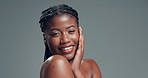 Black woman, touch face and beauty in studio with texture, pride and results on background. African girl, smile and mockup space in portrait, dermatology or skincare with natural cosmetics in Nigeria