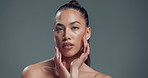 Woman, face and makeup with beauty in studio for cosmetics or skincare on a gray background. Portrait, female person or model with shine or glow for facial skin texture or cosmetology on mockup space