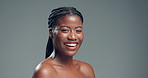 Skincare, mockup space and face of black woman in studio with health, beauty and facial glow. Smile, wellness and portrait of African female person with dermatology for cosmetics by gray background.