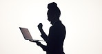 Happy woman, winning and silhouette with laptop in studio for good news on a white background. Excited, female person and celebration with fist pump or computer for promotion or bonus on mockup space