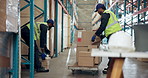 Men, packing and boxes on cart at warehouse for distribution, shipping and inventory management. People, team and loading package for logistics, industrial stock and inspection for quality assurance