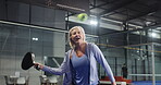 Padel sport, woman and playing on court for tournament match, game practice and workout. Player, mature person and fitness at indoor health club with tennis training, technique exercise and wellness