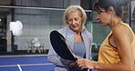 Fitness, women or discussion on court for padel tournament, game or sportsmanship. Athletes, mature people or tennis team with conversation at health club for friendly match, competition or challenge