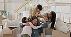 New home, playing and parents with children on sofa excited for moving, relocation and property. Family, house and happy mom, dad and kids for security, bonding and playful relationship for mortgage