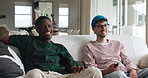 Television, relax and friends on sofa in home with watching movie, show or series together on weekend. Happy, remote and men in living room for streaming film online for entertainment in house.