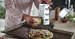 Person, hands and cheese with grater for pizza, food or lunch snack on oven tray in kitchen. Culinary, chef or ingredients with flavor or meal prep for italian cuisine or parmesan recipe in home