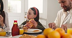 Girl, parents and happy with croissant, breakfast and eating with chat, care and love in home. People, mother and daughter child with dad, talk and bonding with food for nutrition at family house