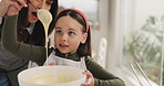 Mom, child and mixing with bowl for baking dessert, meal prep or batter for snack in home kitchen. Mother, help and daughter with spoon for junior baker, learning or childhood development in house