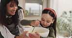 Happy mom, child and baking with bowl for dessert, meal prep or pancake mix in home kitchen. Mother, help and daughter stir with spoon for junior baker, learning or childhood development in house