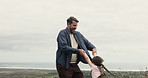 Beach, swinging and girl with father, smile and bonding together with happiness, nature and love. Care, family and parent with daughter, dad and vacation with game, playing and seaside holiday