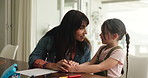Homework, talking and mom with child in home for lesson, learning and help with activity. Family, teaching and mother with girl with books for education, studying together and assessment in house