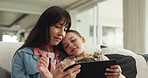 Mom, girl and relax with tablet on couch for hug, streaming and video for elearning on web in home. People, mother and daughter with tech, application or education game on sofa at family house