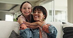 Mom, face and child in house, kiss and embrace on couch, bonding and affection on weekend in lounge. Woman, love and hug daughter in living room, single parent and happy with kid on break in home