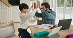 Studying, high five and father with son in family home, teaching problem solving and excited for finish. Homework, man and child celebrate with technology for learning, education support and winning.