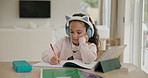 Homeschooling, tablet and child in house with headphones for elearning, project or assignment. Online education, digital technology and girl kid writing in notebook for math assessment in apartment.