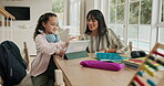 Education, mother and child with tablet for learning, online platform and help with assessment in home. Woman, daughter and tech in living room for elearning, homework and interactive study app