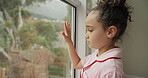 Sad, window and thinking with child in home for depression, separation and fear. Divorced parents, mental health and reflection with girl in apartment for grief, family loss and psychology conflict