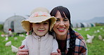Agriculture, hug and face of mom with daughter in countryside for poultry or sustainability. Farmer family, love or smile with girl child and single parent woman embracing outdoor for chicken farming