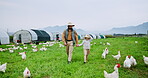 Farmer, father and daughter walking on chicken farm for bonding together, connection or support. Livestock, parent and child holding hands in agro field with journey, agriculture or poultry business.