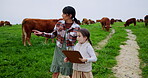 Cow, clipboard and mother with daughter on farm for cattle inventory, agriculture and support. Sustainability report, animal herd tracking and bonding with woman and child in field for growth