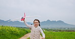 Airplane, nature and child on farm with running, fun or vacation in countryside together. Outdoor, holding hands and parents with girl kid for playing with toy on ranch for holiday with bonding