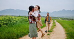 Running, hug and mother with daughter in countryside field for support, bonding or agriculture. Environment, connection and love with parents and child on nature path for sustainability and growth