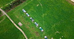 Aerial, agriculture and hen house on farm for development, growth or sustainability. Drone, landscape field and poultry with chicken coop outdoor in countryside for agribusiness or green ecology