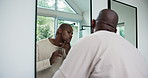 Mirror, face and check with man in bathroom for beard maintenance, skincare and morning routine. Self care, glow and grooming with people and reflection in home for shine, dermatology and facial hair