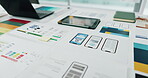 App development, documents and ui design of phone on desk in creative workplace for planning. Laptop, paper and tablet on table in office for digital interface, experience or graphic model of mobile