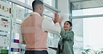 Happy people, web designer and tablet with high five on glass board for UI development in office. Businessman, woman or colleagues with smile or technology for online UX or digital success together