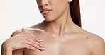 Skincare, chest and and beauty with hands of woman in studio for body care, aesthetic and hydration glow. Touch, dermatology and moisturize with person on white background for mockup space and shine